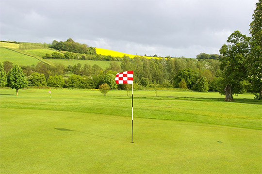 windy golf green and with flag