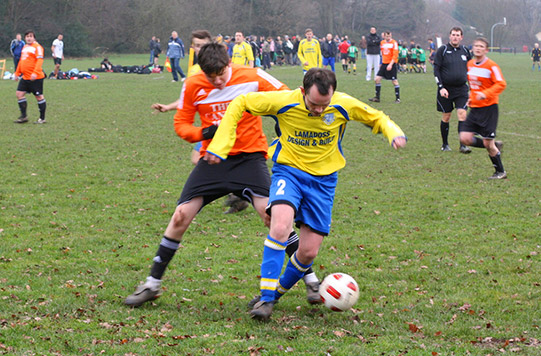 playing soccer in rain